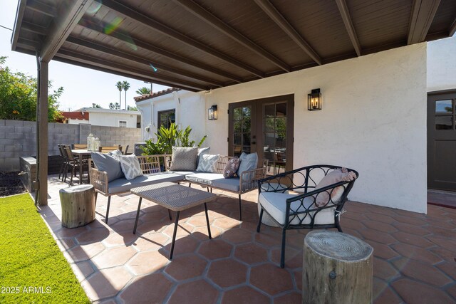 1309 W Lynwood St, Phoenix, AZ 85007 - view of patio / terrace featuring french doors, fence, an outdoor hangout area, and outdoor dining area