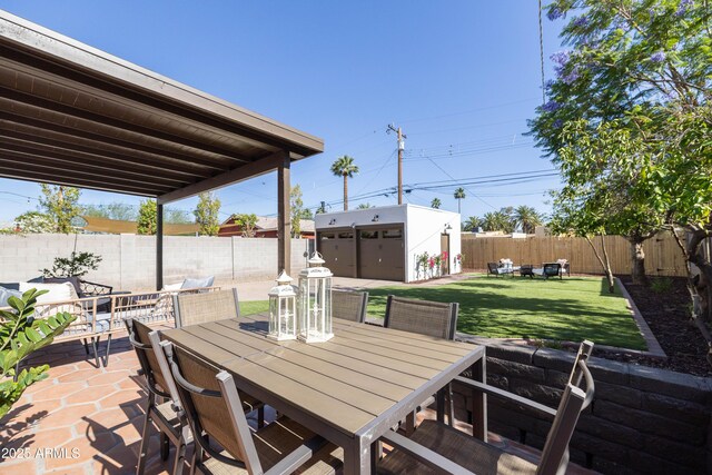 1309 W Lynwood St, Phoenix, AZ 85007 - view of patio / terrace with outdoor dining area and an outbuilding