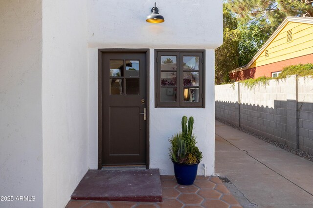 1309 W Lynwood St, Phoenix, AZ 85007 - doorway to property with stucco siding and fence
