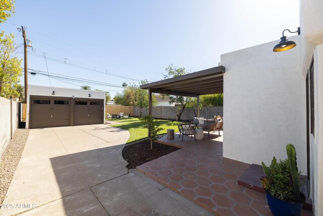 1309 W Lynwood St, Phoenix, AZ 85007 - view of patio / terrace with an outbuilding, a garage, and an outdoor hangout area
