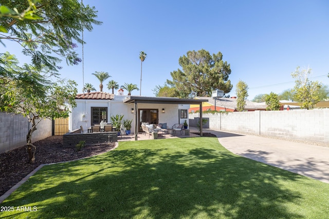 1309 W Lynwood St, Phoenix, AZ 85007 - rear view of property featuring stucco siding, an outdoor living space, a tile roof, and a patio area