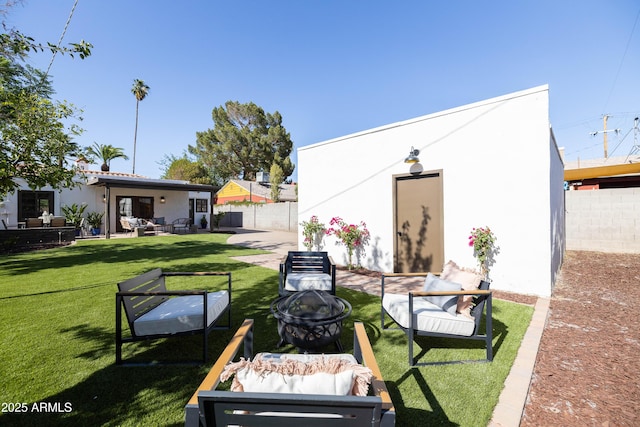 1309 W Lynwood St, Phoenix, AZ 85007 - view of yard featuring an outdoor living space with a fire pit, a patio, and an outbuilding