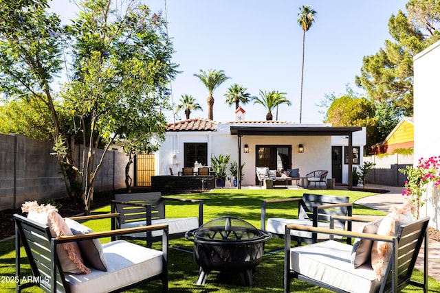 1309 W Lynwood St, Phoenix, AZ 85007 - rear view of house with an outdoor living space with a fire pit, french doors, stucco siding, and a tile roof