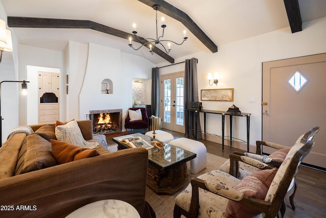 1309 W Lynwood St, Phoenix, AZ 85007 - living room featuring dark wood-style floors, french doors, a chandelier, and plenty of natural light