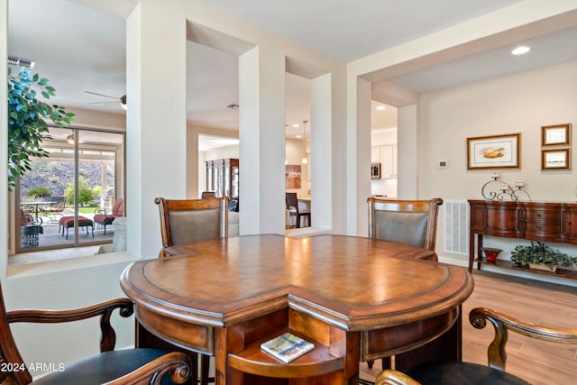 dining room featuring light hardwood / wood-style flooring and ceiling fan