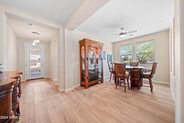 dining room featuring light wood-type flooring and ceiling fan