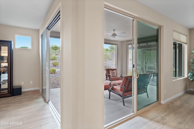 interior space with ceiling fan, light hardwood / wood-style flooring, and a wealth of natural light