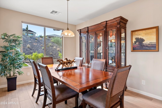 dining area featuring light wood-type flooring