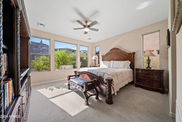 bedroom with ceiling fan and light colored carpet