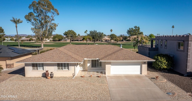 ranch-style home with a garage