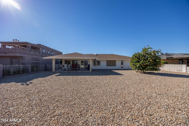 rear view of house featuring a patio