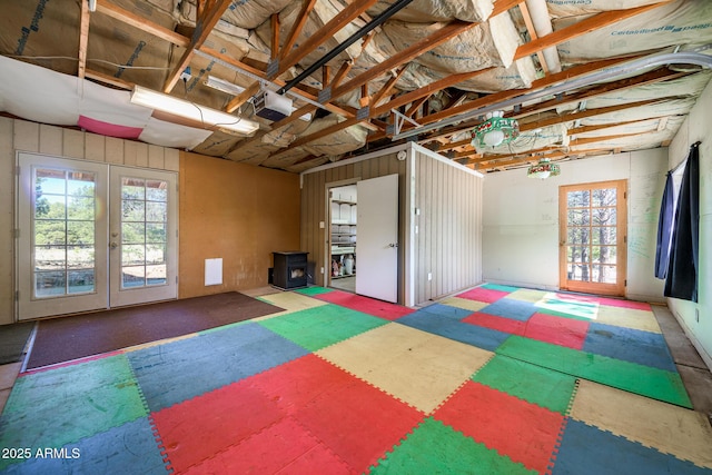 basement with french doors and a garage