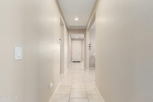 hallway with light tile patterned floors