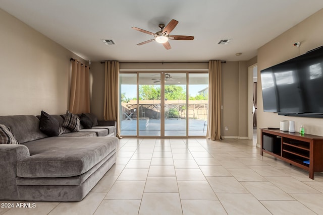 tiled living room with ceiling fan