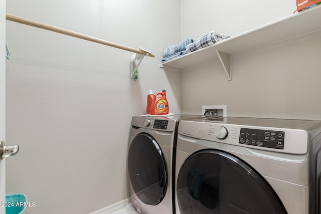 washroom with washing machine and dryer