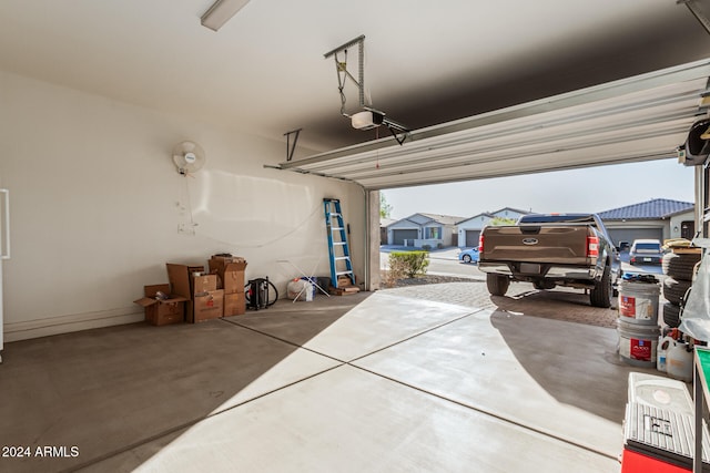 garage featuring a garage door opener