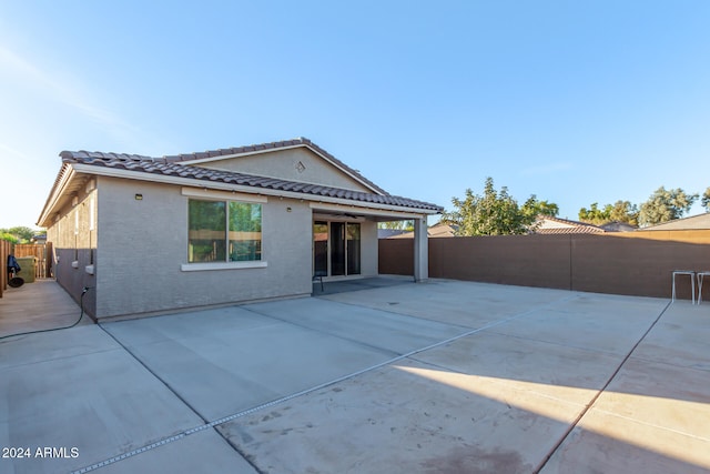 rear view of house with a patio