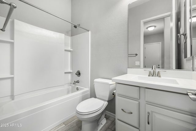 full bathroom with vanity, hardwood / wood-style floors, tub / shower combination, and toilet