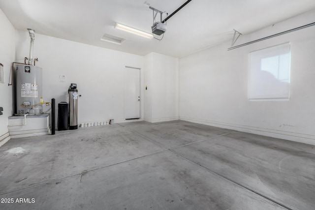 garage with a garage door opener and water heater