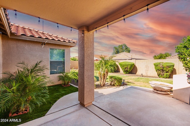 patio terrace at dusk with a lawn