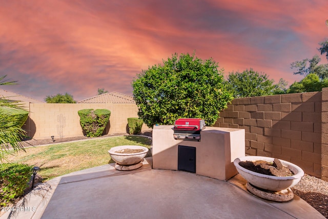 patio terrace at dusk with a yard