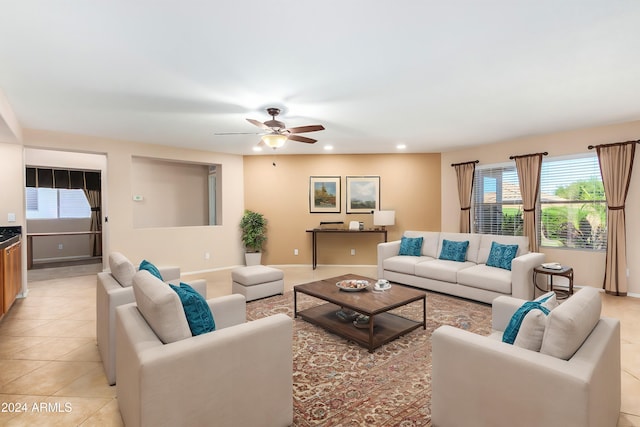 living room with ceiling fan and light tile patterned floors