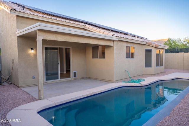 15067 W Taylor St, Goodyear, AZ 85338 - view of swimming pool featuring a patio and a fenced backyard