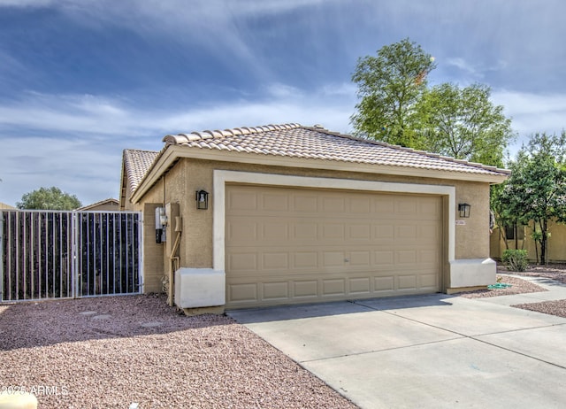 15067 W Taylor St, Goodyear, AZ 85338 - garage with concrete driveway and fence