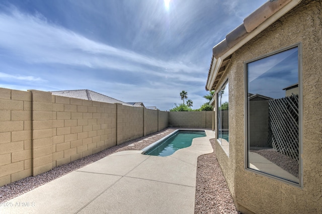15067 W Taylor St, Goodyear, AZ 85338 - view of swimming pool featuring a fenced backyard and a patio area