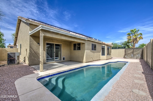 15067 W Taylor St, Goodyear, AZ 85338 - view of pool featuring central AC, a fenced backyard, and a patio area