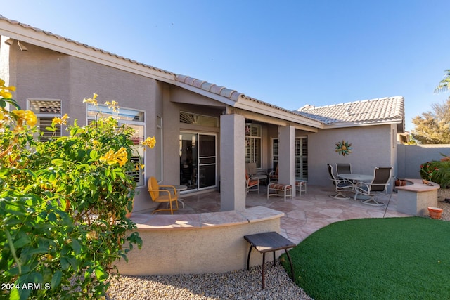 rear view of property with a patio