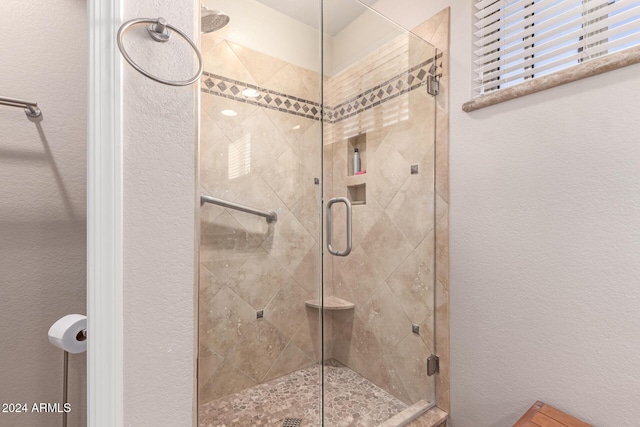 bathroom with an enclosed shower