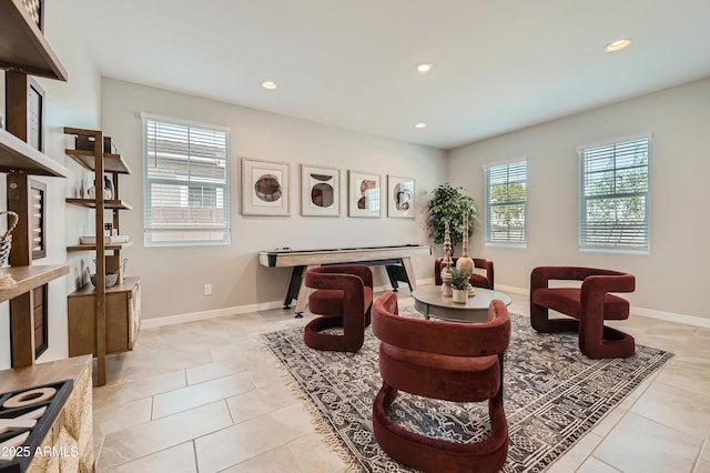 sitting room with light tile patterned flooring, recessed lighting, and baseboards