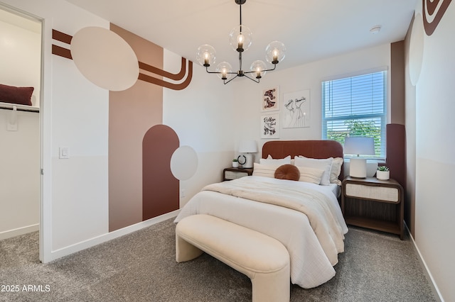 bedroom with an inviting chandelier, baseboards, and carpet floors