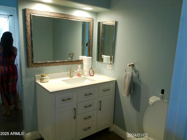 6139 E Voltaire Ave, Scottsdale, AZ 85254 - bathroom with vanity and toilet