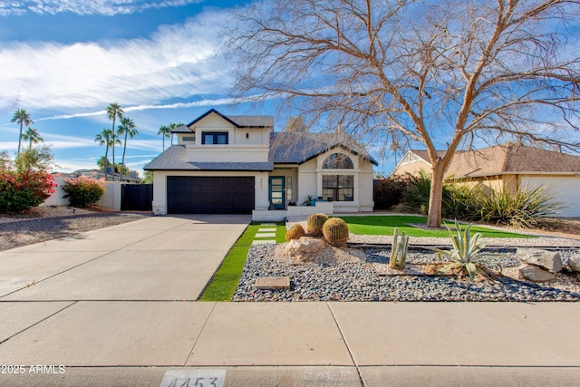 view of front of house with a garage and a front lawn