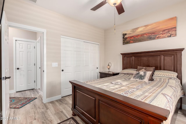 17139 S 174th Dr, Goodyear, AZ 85338 - bedroom featuring a closet, light wood-style flooring, a ceiling fan, and baseboards