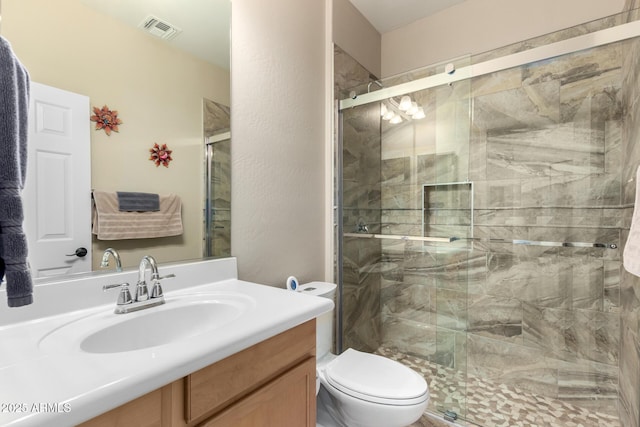 17139 S 174th Dr, Goodyear, AZ 85338 - bathroom with a shower stall, vanity, visible vents, and toilet
