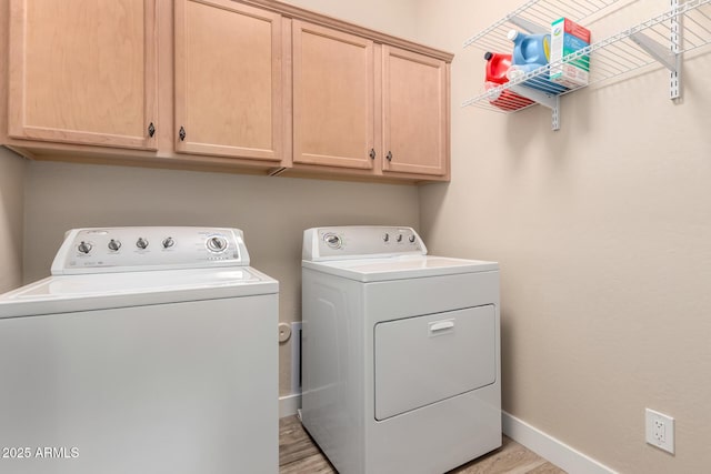 17139 S 174th Dr, Goodyear, AZ 85338 - washroom featuring light wood finished floors, baseboards, cabinet space, and washing machine and dryer