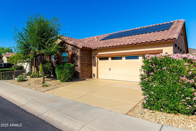 17139 S 174th Dr, Goodyear, AZ 85338 - view of front of home featuring a tiled roof, an attached garage, and stucco siding