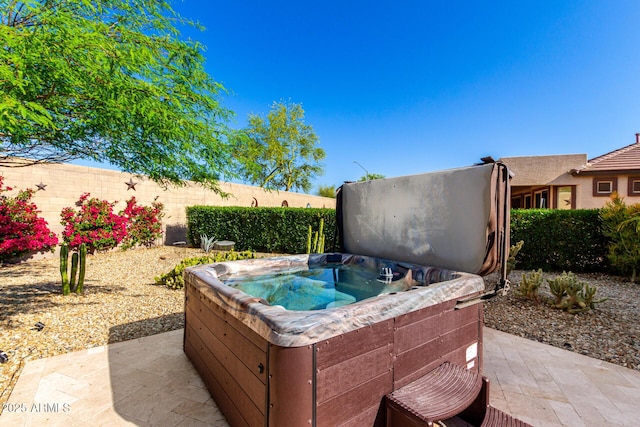17139 S 174th Dr, Goodyear, AZ 85338 - view of patio / terrace featuring fence and a hot tub