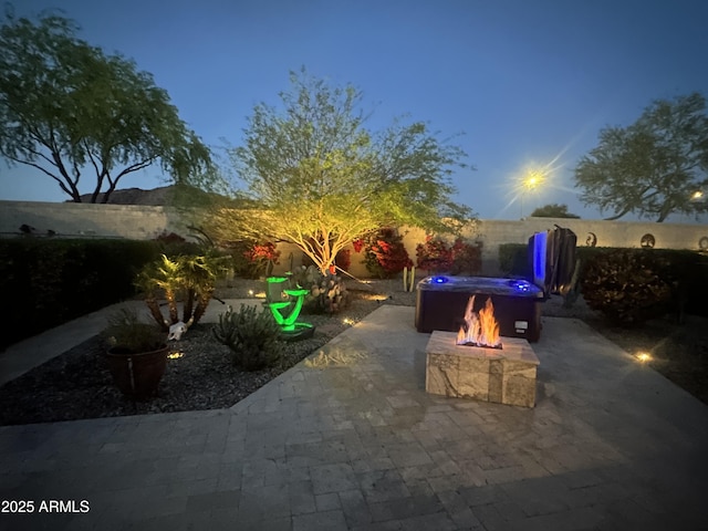 17139 S 174th Dr, Goodyear, AZ 85338 - view of patio featuring an outdoor fire pit and a fenced backyard