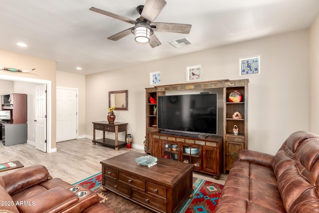 17139 S 174th Dr, Goodyear, AZ 85338 - living area featuring light wood-style flooring, a ceiling fan, visible vents, recessed lighting, and baseboards