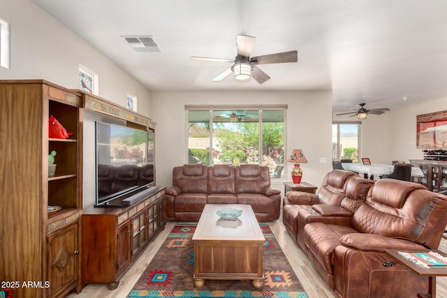 17139 S 174th Dr, Goodyear, AZ 85338 - living room with visible vents, ceiling fan, and light wood-style floors
