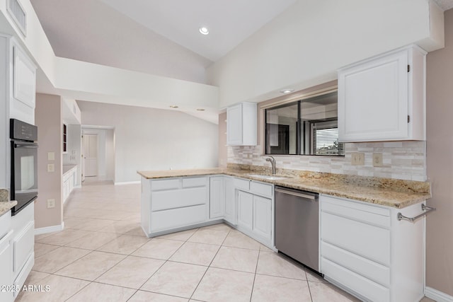 kitchen with visible vents, oven, dishwasher, vaulted ceiling, and a sink