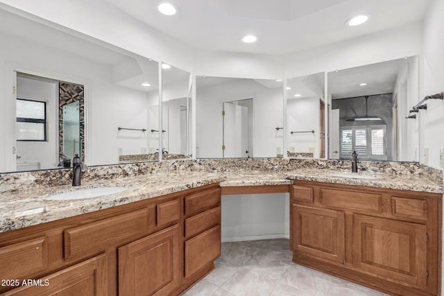 bathroom with tile patterned floors, recessed lighting, and vanity