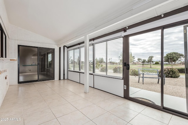 unfurnished sunroom with vaulted ceiling