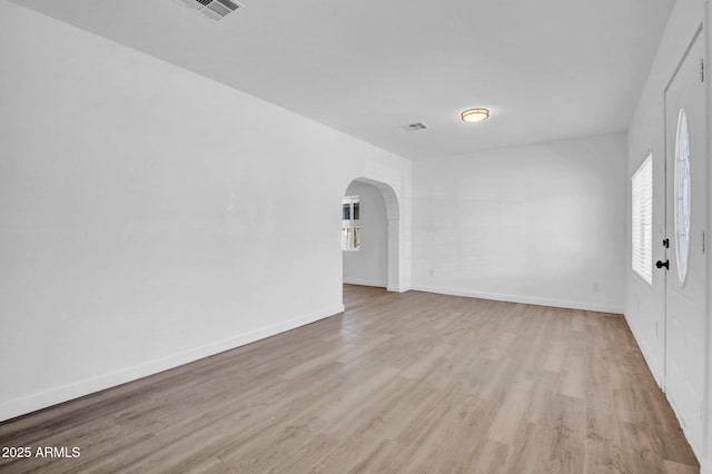 538 S Macdonald, Mesa, AZ 85210 - spare room with arched walkways and wood finished floors