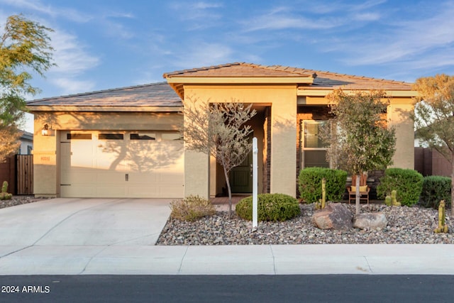 prairie-style house featuring a garage