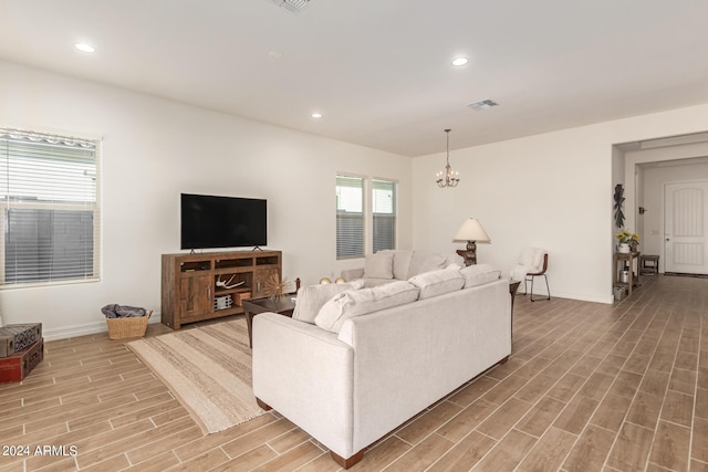 living room featuring an inviting chandelier